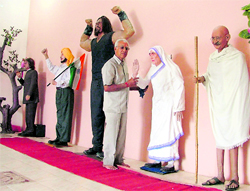 Chander Shekhar Prabhakar, a city-based amatuer, stands with his wax statues
