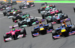 Red Bull Racings driver Sebastian Vettel (R) leads after the start of European Grand Prix at the Valencia Street Circuit on Sunday. Vettel went on to win the race