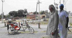 Gurcharan Singh points towards the house of Giani Zail Singh in Sandhwan village. 