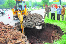 The road stretch that caved in beside the roundabout separating Sectors 20 and 30 in Chandigarh on Monday morning.