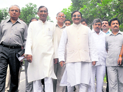 Chief Minister Ramesh Pokhriyal Nishank walks barefoot from his residence to the Secretariat in protest against the hike in the prices of petroleum products, in Dehradun on Monday