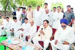 INLD MLA Abhey Singh Chautala (second from right) addresses residents of Bhawdeen village in Sirsa
