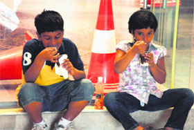 Children enjoy ice cream at a mall in Gurgaon. 