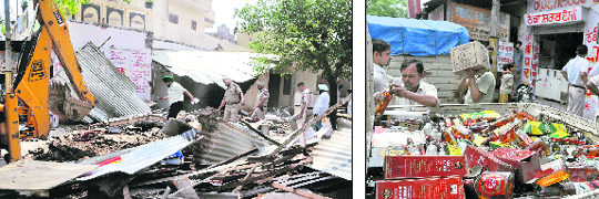 A liquor vend which was demolished by the Municipal Corporation in Ludhiana on Monday; and (right) the bottles of liquor being removed from the site.