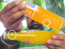 Fungus inside sealed bottles of Coke, Fanta and Maaza.