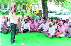  Draftsmen hold a rally in support of their demands in Ludhiana on Monday. 