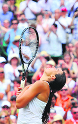Marion Bartoli celebrates after defeating defending champion Serena Williams in London on Monday.