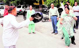Members of two groups clash at the Dehradun Municipal Corporation on Tuesday.