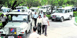 Vehicles parked inside Gandhi Park during a political rally in Dehradun.