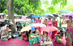 Class IV employees hold a rally in support of their demands at Gandhi Park in Dehradun on Tuesday