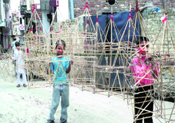 Children help make kanwars in Haridwar on Tuesday