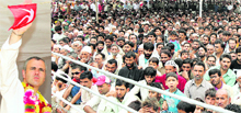 Chief Minister Omar Abdullah waves at a gathering in Budgam on Tuesday. He later left the venue without making any commitment on the grant of district status to Beerwa town.