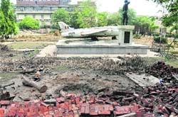 The statue of Param Vir Chakra awardee, Nirmaljit Singh Sekhon, amid the rubble that will make way for a multi-storeyed parking near the mini-secretariat in Ludhiana