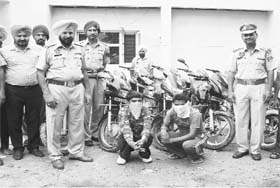 The accused, who stole motorcycles, in police custody