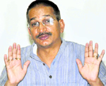 Kishore Upadhyaya addresses a press conference in Dehradun on Wednesday