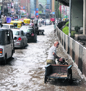 A Panipat road looks like a water channel after a dowpour on Wednesday, giving a tough time to motorists