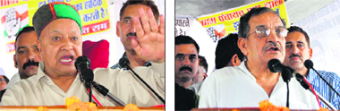 Union Minister Virbhadra Singh addresses a mass rally of the Congress at Baddi in Solan district on Wednesday; and (right) Congress in charge of the state Virender Chowdhary at the rally.