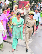 Women officials of the Himachal Pradesh Board of School Education being taken to a court at Dharamsala on Wednesday.