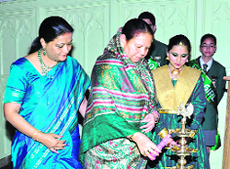 Governor Urmila Singh lights a lamp at the centenary celebrations of St Thomas School in Shimla on Wednesday.