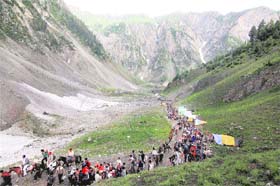Pilgrims leave Baltal on the way to the holy cave shrine of Amarnath on Wednesday