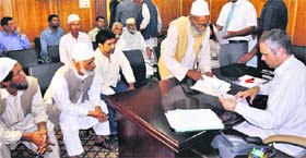 Chief Minister Omar Abdullah listens to the grievances of people during an awami mulakat in Srinagar on Wednesday