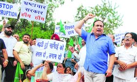 Activists of the PDP stage a protest against the fuel price hike in Jammu on Wednesday