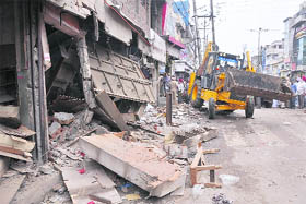 A ditch machine of the MC demolishes an illegal shop in the Field Ganj area in Ludhiana on Wednesday.