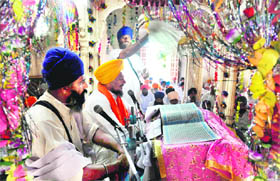 Sikh pilgrims attend a ceremony held to mark the 172nd death anniversary of Maharaja Ranjit Singh at Gurdwara Dehra Sahib in Lahore and (below) an inside view of the Maharaja Ranjit Singh Panorama in Amritsar.