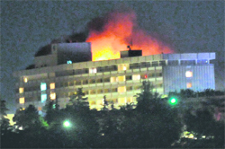 Smoke and flames rise from the Intercontinental Hotel during a battle between NATO-led forces and and Taliban insurgents in Kabul on Wednesday