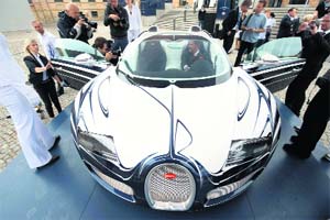 View of a newly unveiled Bugatti Veyron 16.4 Grand Sport "L'Or Blanc" in Berlin on Thursday. The luxury sports car, designed in cooperation with KPM - Knigliche Porzellan-Manufaktur Berlin incorporates designs inspired from porcelain, and porcelain elements and costs Euros 16,00,000.