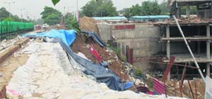 A portion of land along the National Highway 21 that caved in due to digging by a private company engaged in the construction of a multi-storeyed bus stand complex at Sector 57, Mohali. 