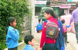 The parents along with their wards pass a liquor vend in Mussoorie. 