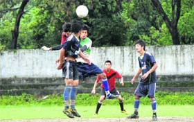 Players vie for the ball in a match of the Lala Nemi Dass Memorial District Football League at the Pavilion ground in Dehradun on Thursday.