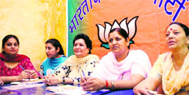 Urmil Thakur (second from right), in-charge of the BJP Mahila Morcha for Jammu and Kashmir, at a meeting of party activists in Jammu on Thursday.