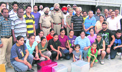 Players and coaches, who were honoured by the Punjab Basketball Associations, in Ludhiana on Thursday. 