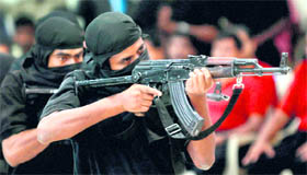 Members of the state-response counter-terrorism team display their skills during a police function in Bangalore on Wednesday.