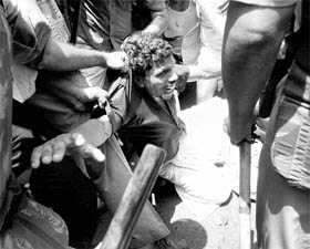 The police arrests an AIYF worker agitating against the governments policy on self-finance management college admissions in Kozhikode on Thursday.