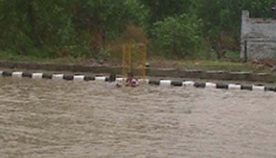 It was fun time for children as they try their hands at swimming in the rainwater accumulated on the 100-feet road in the city.