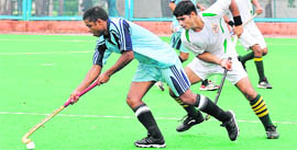 test of skill A player dribbles the ball during a match of the Air Force Hockey Championship 2011 at 3BRD Air Force Station in Chandigarh on Friday.