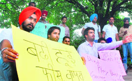 NSUI activists stage a dharna in front of the VCs office at Panjab University in Chandigarh on Friday.
