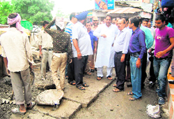 Mayor Vinod Chamoli inspects work at a drainage in Dehradun on Friday