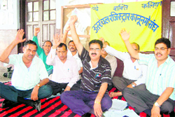 Members of the Uttarakhand Registrar Kanungo Sangh hold a dharna in Dehradun on Friday