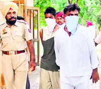 The accused being taken to the court in Ludhiana