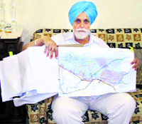 Irrigation Minister Janmeja Singh Sekhon shows a sketch of the Hansi-Butana canal, in Ferozepur