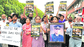 Sumit's family members and supporters during a candlelight march seeking probe into his death, in Chandigarh on Saturday