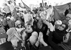 Thousands of Libyans march in central Tripoli. A speech by Muammar Gaddafi to mark 100 days of NATO operations was played over loudspeakers in the heart of the capital on Friday