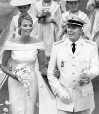 Monaco's Prince Albert II (R) and his bride Princess Charlene leave the Royal Palace after the wedding ceremony on Saturday