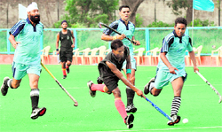 Players in action during a match of the Air Force Hockey Championship at the 3BRD Air Force Station in Chandigarh on Sunday