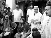 Rangolata (sitting in a chair) after being united with her family in Orissa