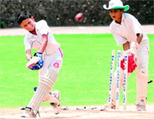 A batsman plays a shot during a cricket match in Chandigarh on Sunday